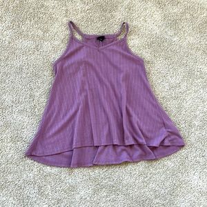 A loose purple tank top, ribbed